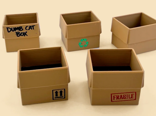 Five box choices: Dumb Cat Box lettering, Recycling, Plain, This Way Up arrows, and Fragile. Choose a box for each cat in your selected pack.